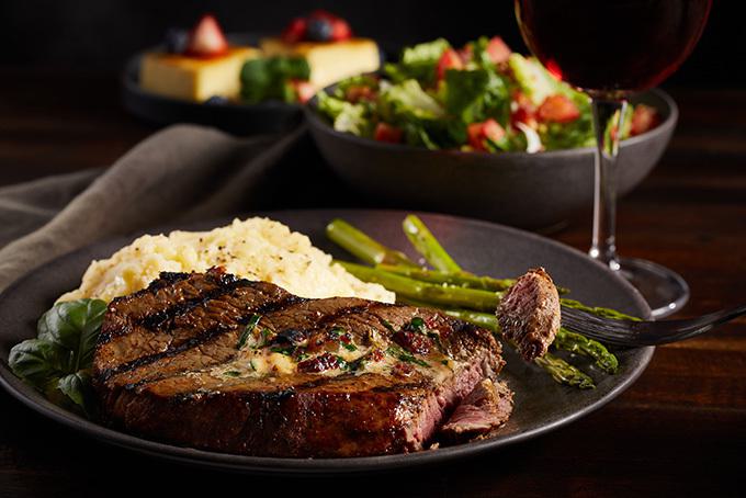 Sirloin steak with sides and salad